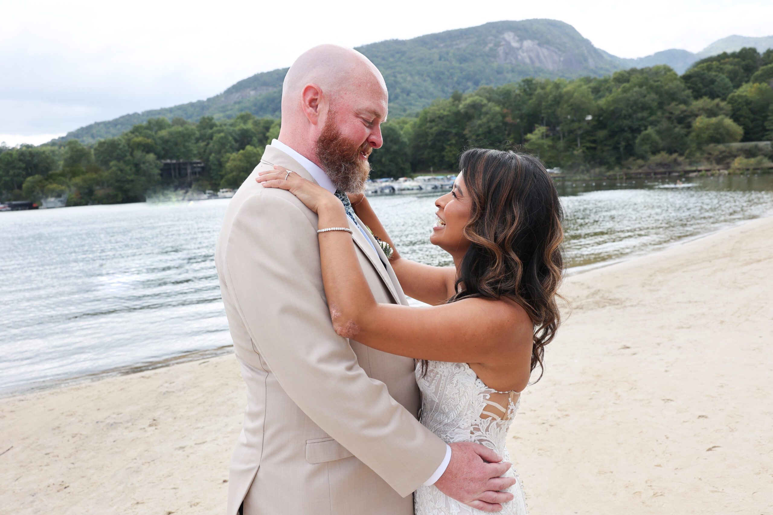 Wedding couple on beach at Rumbling Bald n Lake Lure.